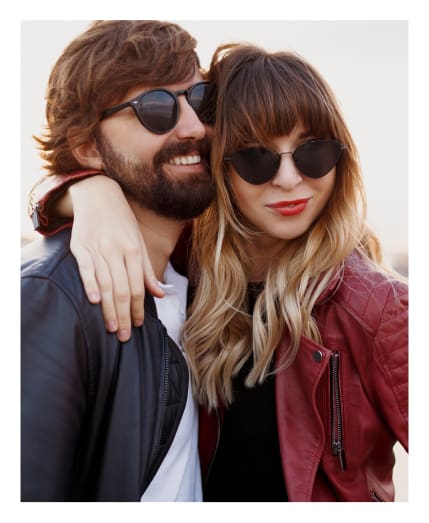 A couple wearing sunglasses from Big City Optical