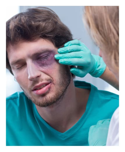 doctor treating man eye injuries at Big City Optical