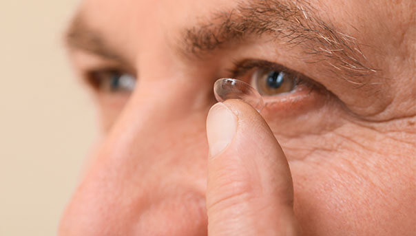 Man putting on a Multifocal Lens