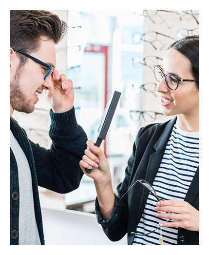 Man checking eyeglasses at Big City Optical<br />
