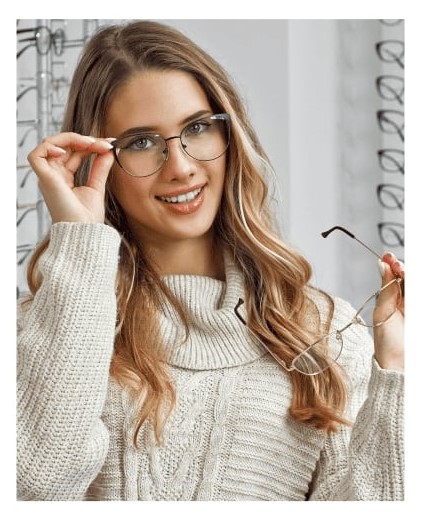 A woman selecting eyeglasses at Big City Optical.<br />
