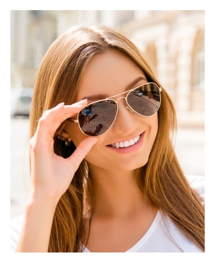 Woman wearing sunglasses at Big City Optical