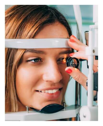 Woman undergoing contact lens exam at Big City Optical