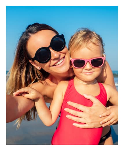Mother and child wearing their sunglasses at Big City Optical