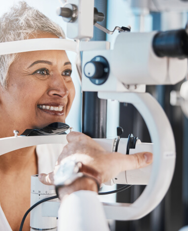 Woman getting a contact lens exam at BCO