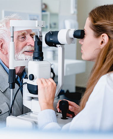 Man with doctor an eye exam at Big City Optical