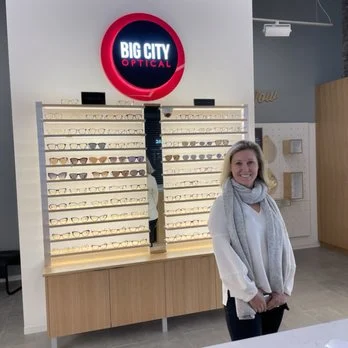 A father carrying his child on his shoulders while strolling.<br />
