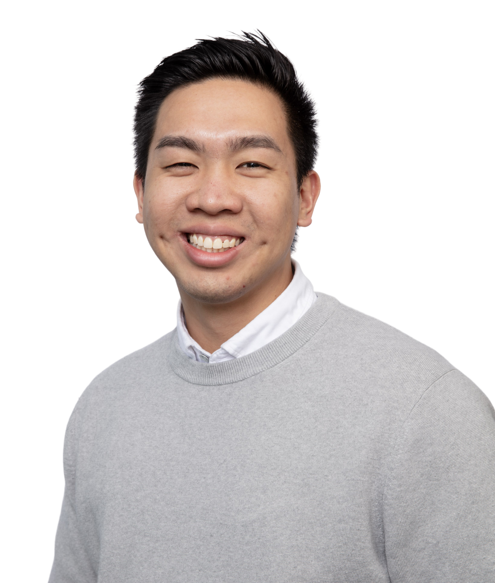 Headshot of Dr. Nicholas Vo smiling in a grey sweater against a black background at Big City Optical in Chicago.