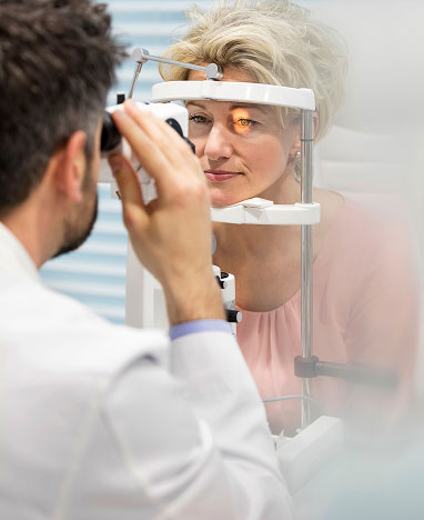 A father carrying his child on his shoulders while strolling.<br />
